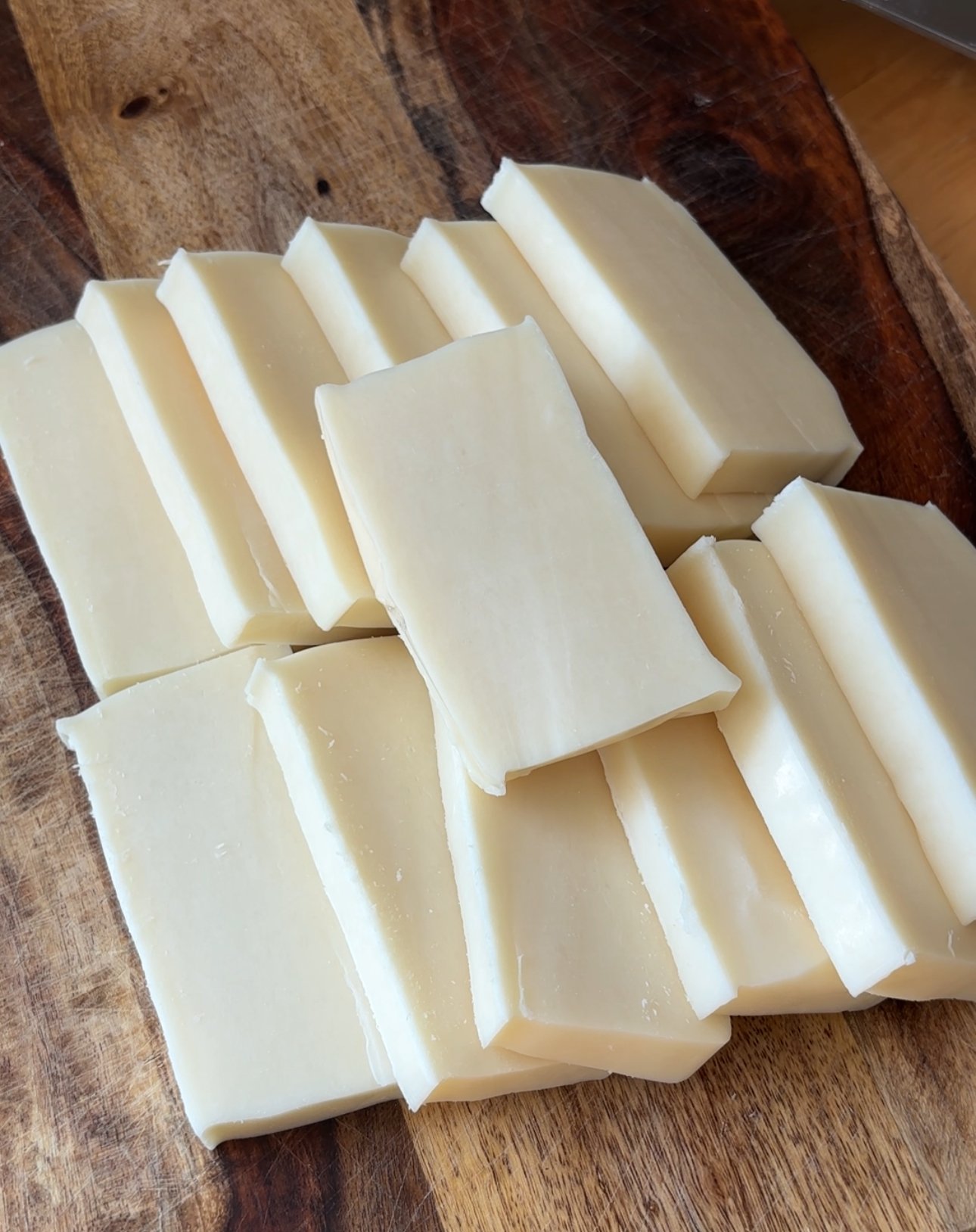 cut up mozzarella cheese for Sourdough Mozzarella Sticks