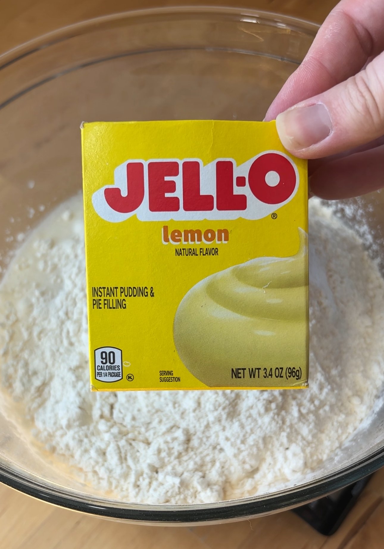 a picture of lemon jell-o in front of a bowl of flour
