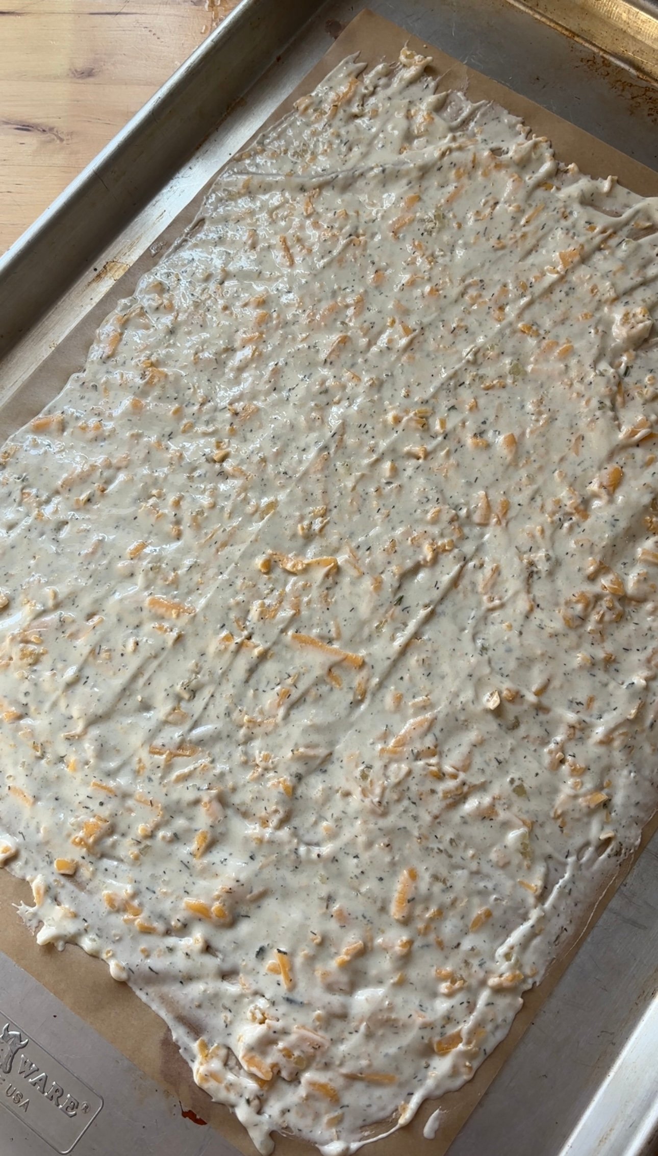 Sourdough Discard Crackers dough spread on a baking sheet
