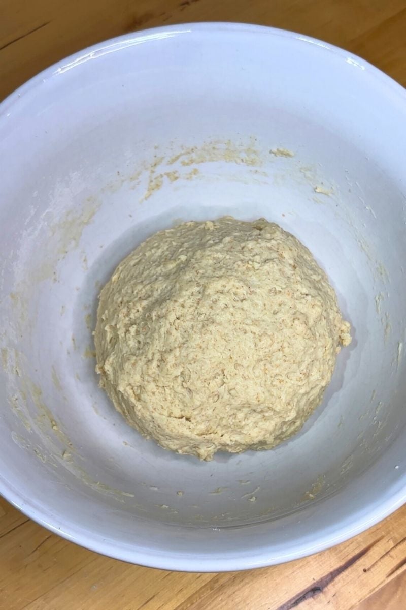 Sourdough Protein Cinnamon Roll dough in a white bowl
