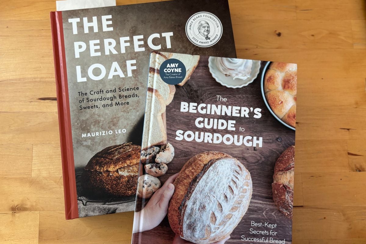 Sourdough Cookbooks on a wood background the perfect loaf and the beginners guide to sourdough