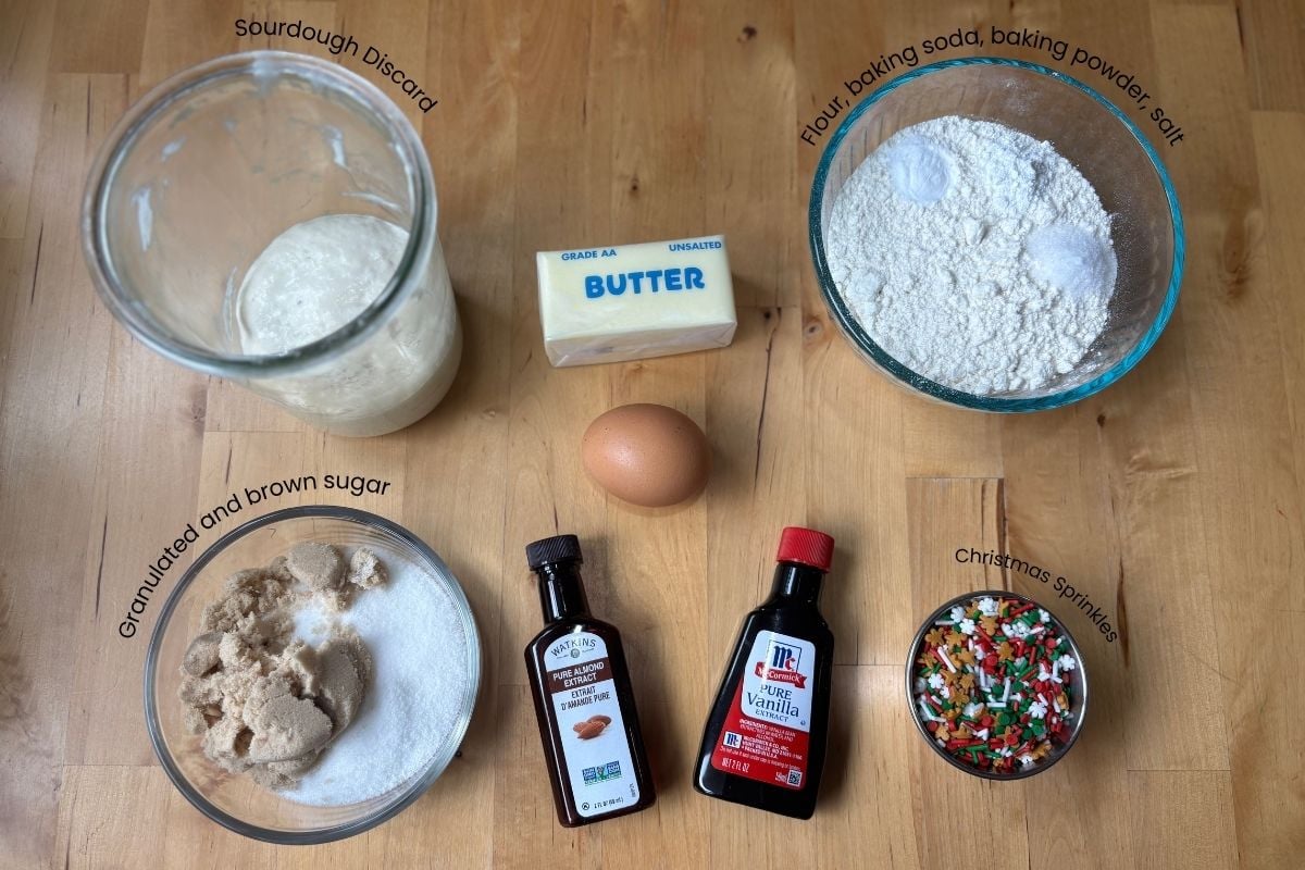 ingredients for soft sourdough discard Christmas cookies laid out on a wooden table