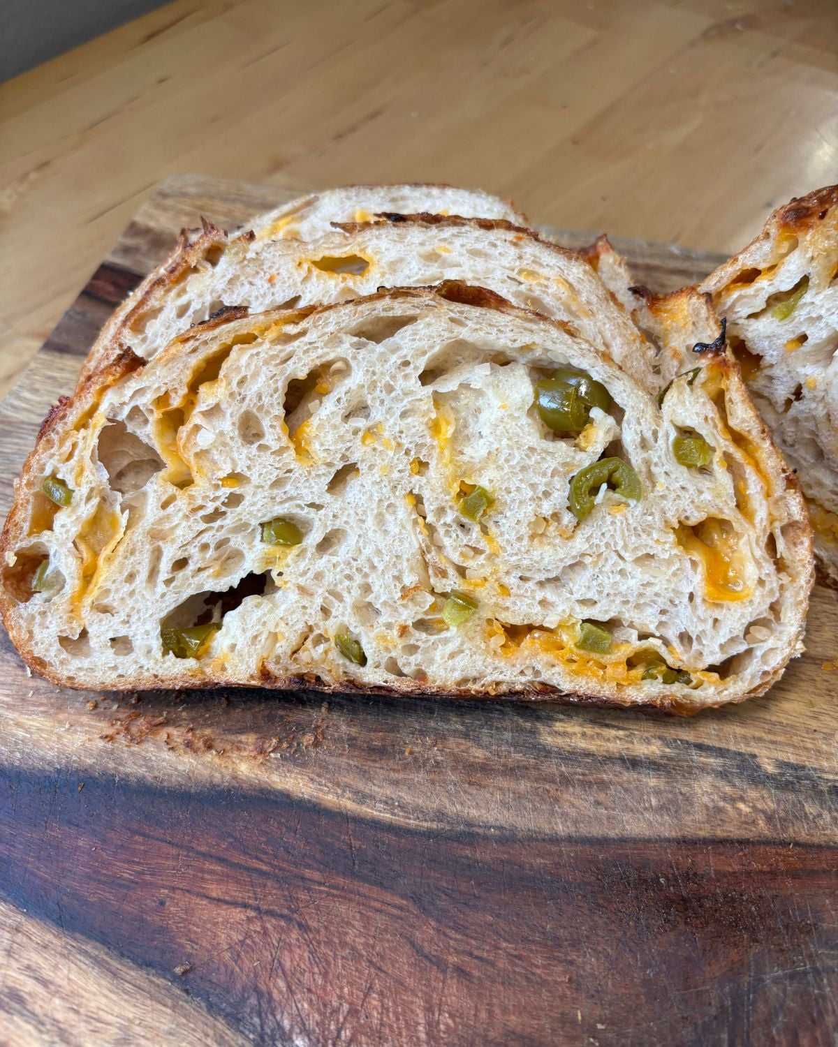 sliced Jalapeño Cheddar Sourdough with hot honey glaze